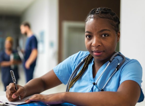 medium-shot-smiley-nurse-with-stethoscope_23-2149741212
