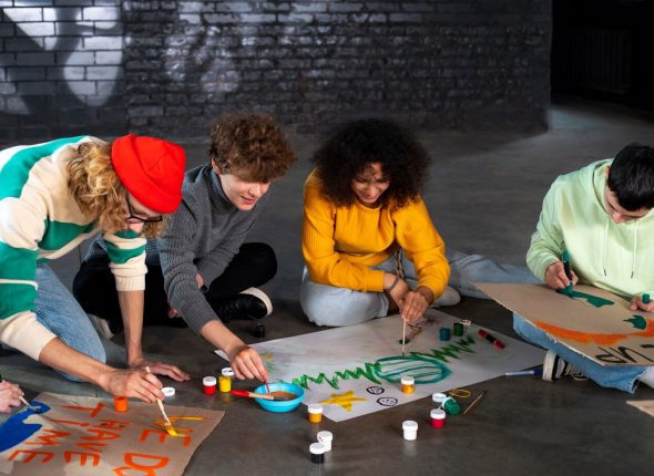 full-shot-people-making-banners-floor_23-2149343463