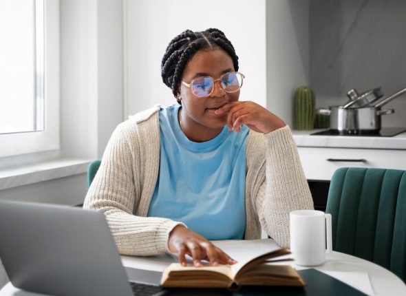 medium-shot-woman-with-laptop-home_23-2150170909